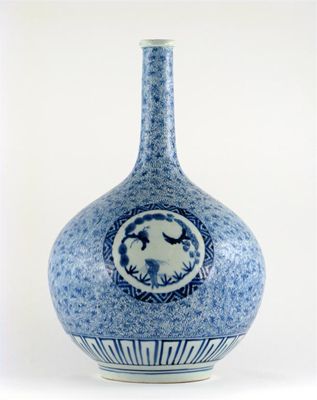 Appraisal: A Japanese blue and white bottle decorated with three roundels