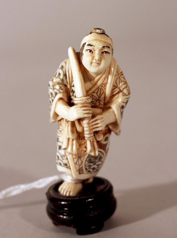 Appraisal: Japanese ivory netsuke Japanese ivory netsuke warrior with sword very