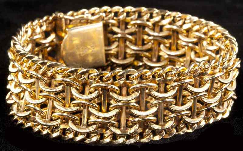 Appraisal: Gold Fancy Link Braceletcomposed of flexible curved and bar textured