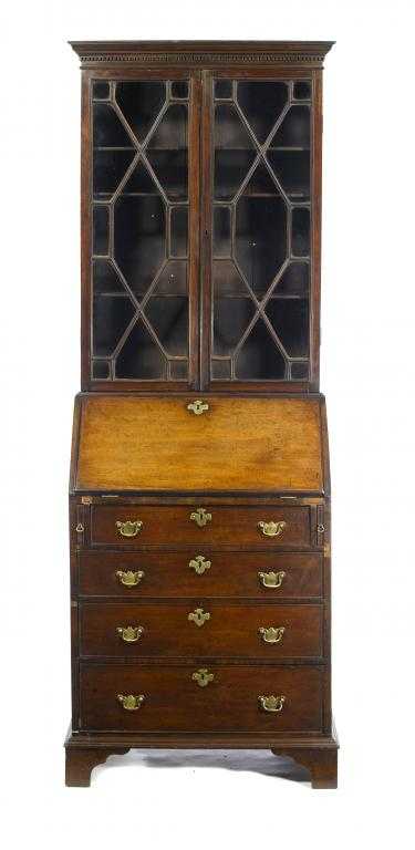 Appraisal: A GEORGE III MAHOGANY BUREAU-BOOKCASE the dentil cornice above a