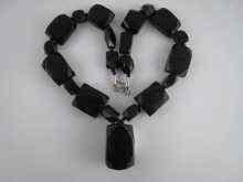 Appraisal: A jet necklace with large shaped rectangular beads largest x