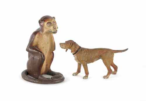 Appraisal: Cast iron monkey doorstop th c h together with a