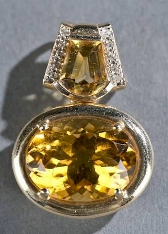 Appraisal: Citrine and diamond pendant A citrine and diamond pendant in