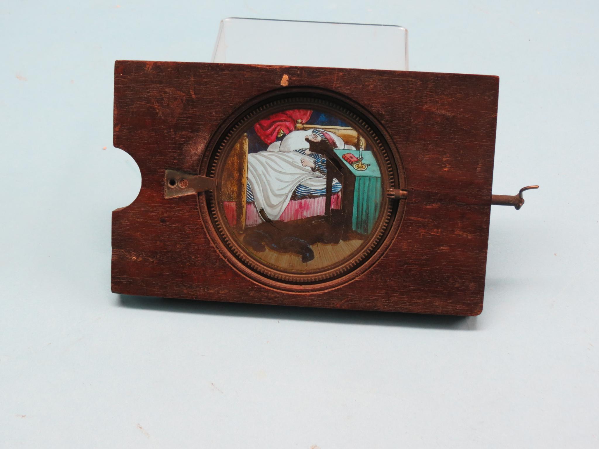 Appraisal: Victorian optical amusements painted glass slides with mechanical operation as