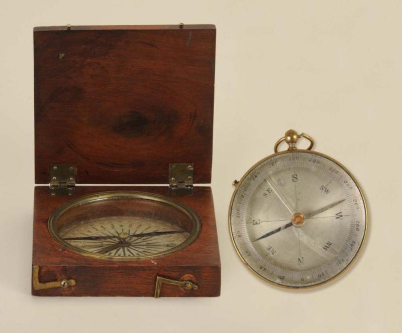 Appraisal: Lot of Handheld Compasses Description Wooden case with brass latches