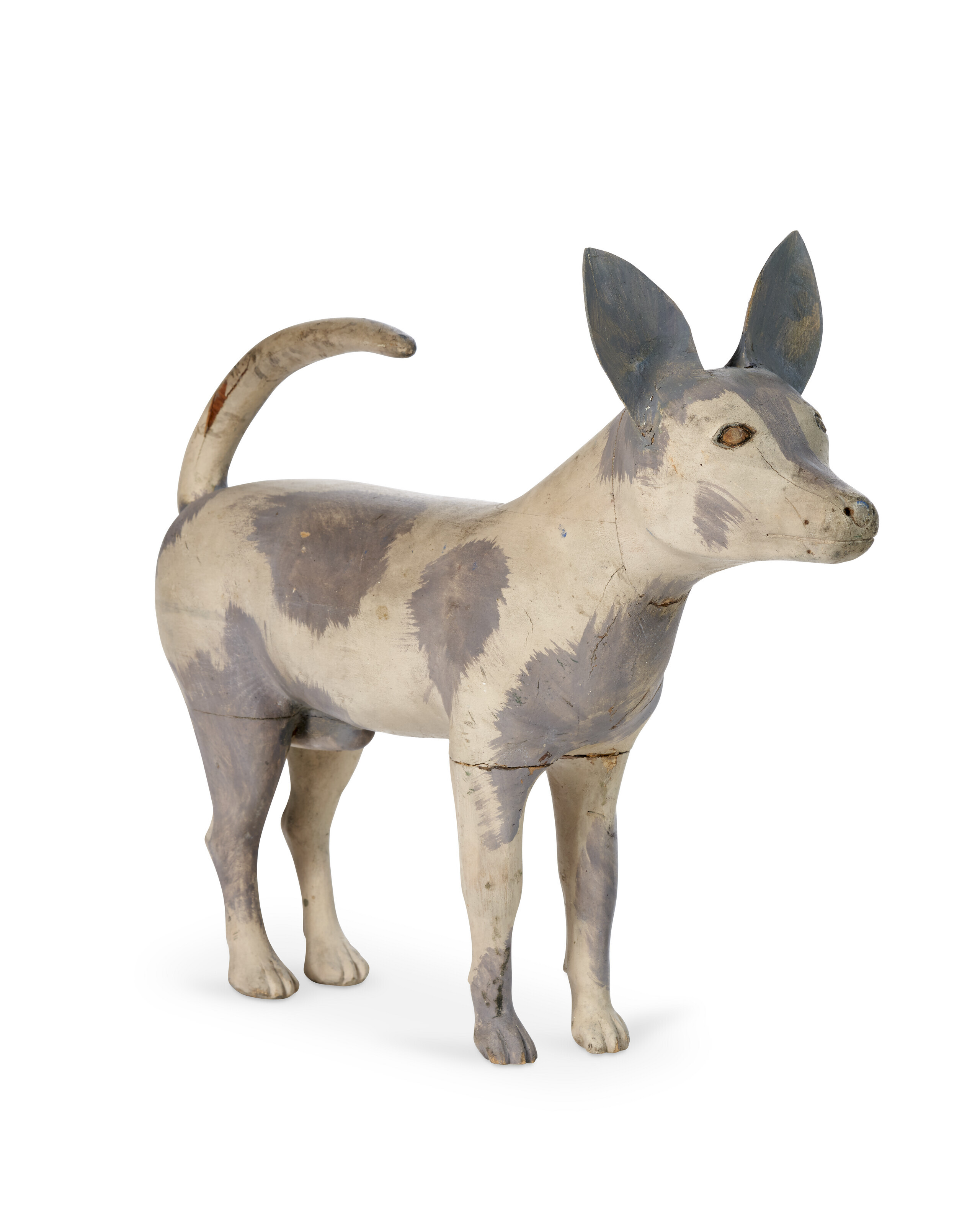 Appraisal: A CARVED AND PAINTED WOOD SCULPTURE OF DOG ATTRIBUTED TO