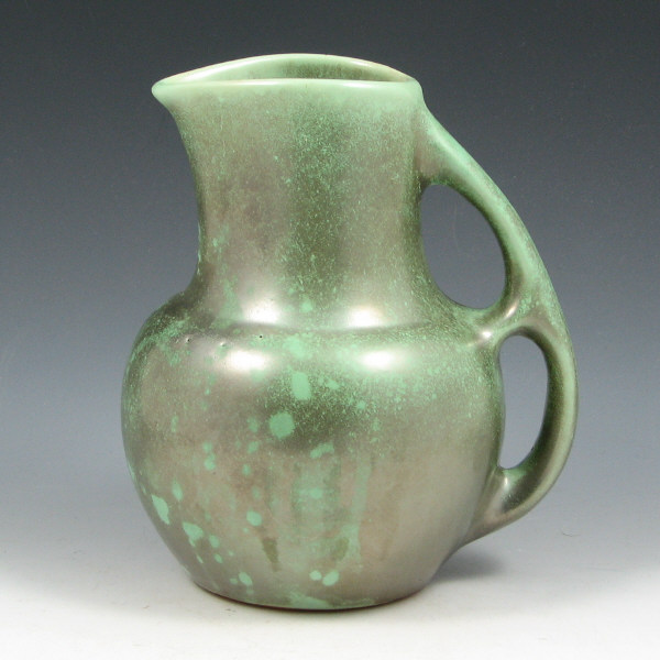 Appraisal: Shearwater pitcher in a terrific green glaze with a slightly