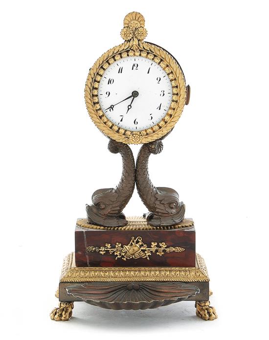 Appraisal: French parcel-gilt bronze and rouge marble clock th century laurel-leaf