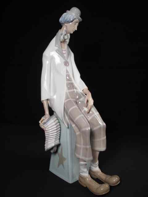 Appraisal: A Lladro porcelain clown holding a Concertina Measures '' tall