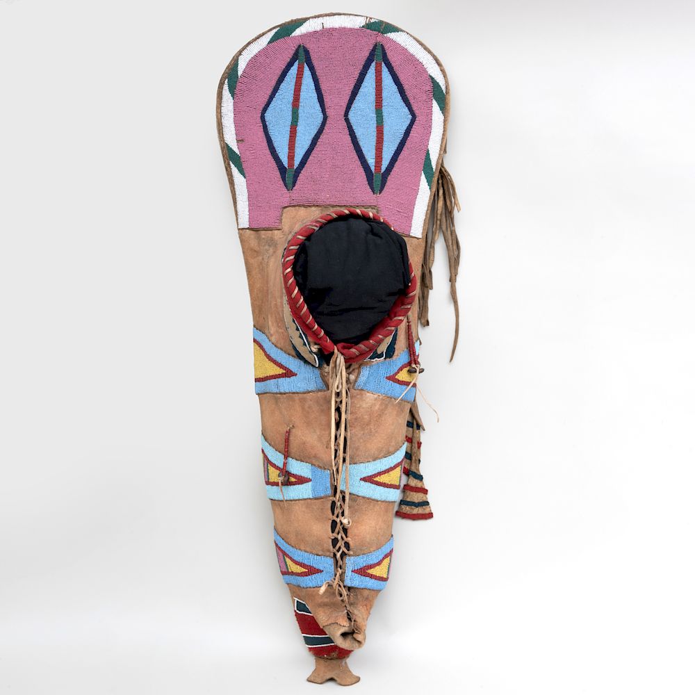 Appraisal: Crow Beaded Hide and Trade Cloth Papoose Carrier Constructed of