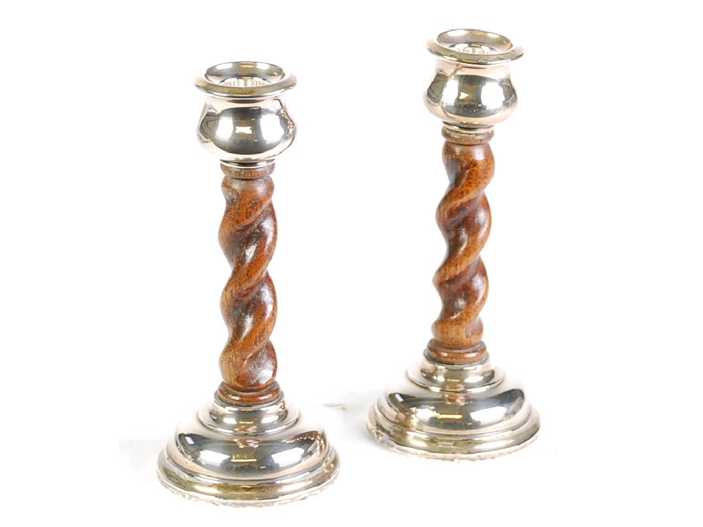 Appraisal: PAIR OF GEORGE V SILVER MOUNTED OAK BARLEY TWIST CANDLESTICKS