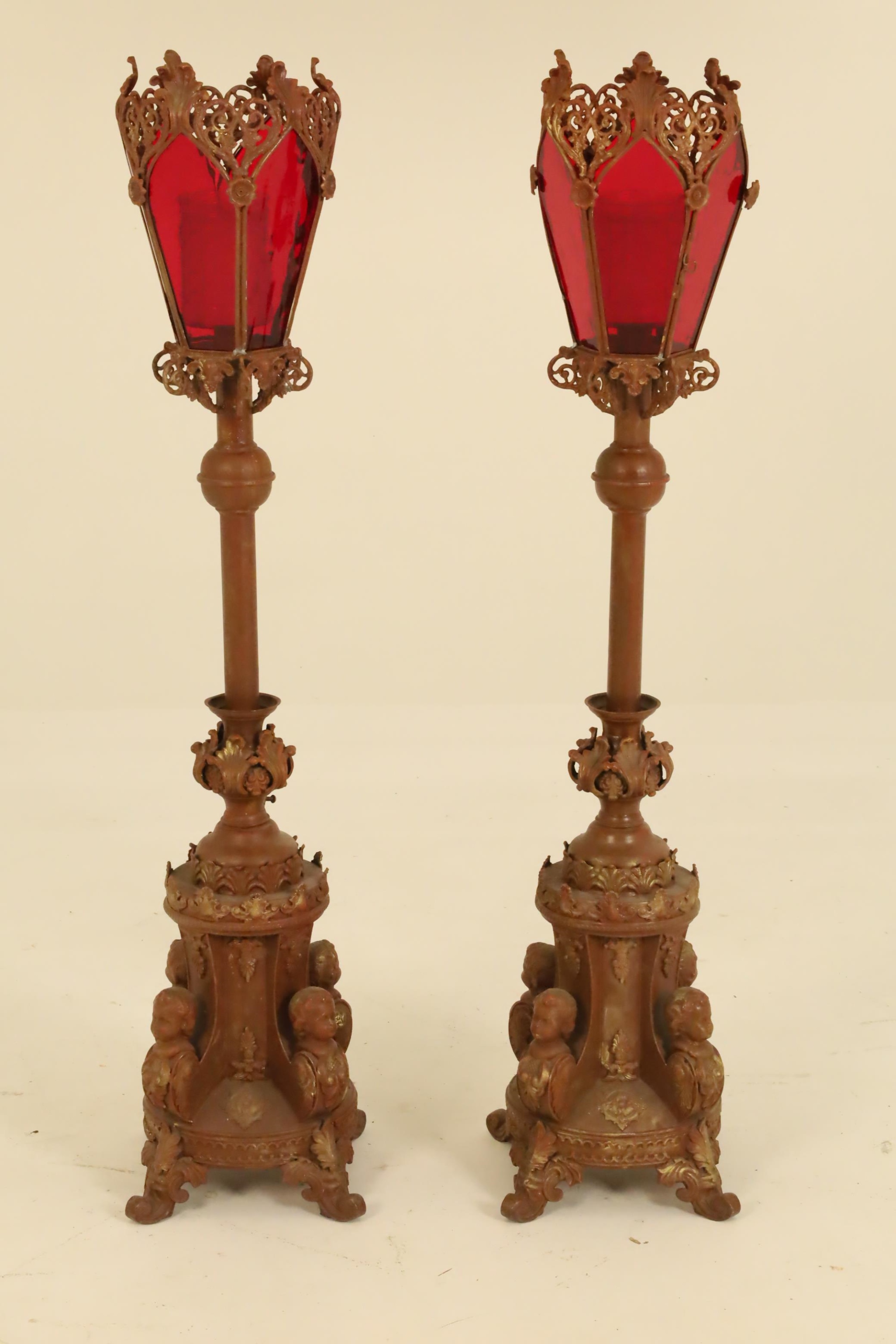 Appraisal: SPANISH COLONIAL CATHEDRAL TORCHIERES Pair of patinated metal Spanish Colonial