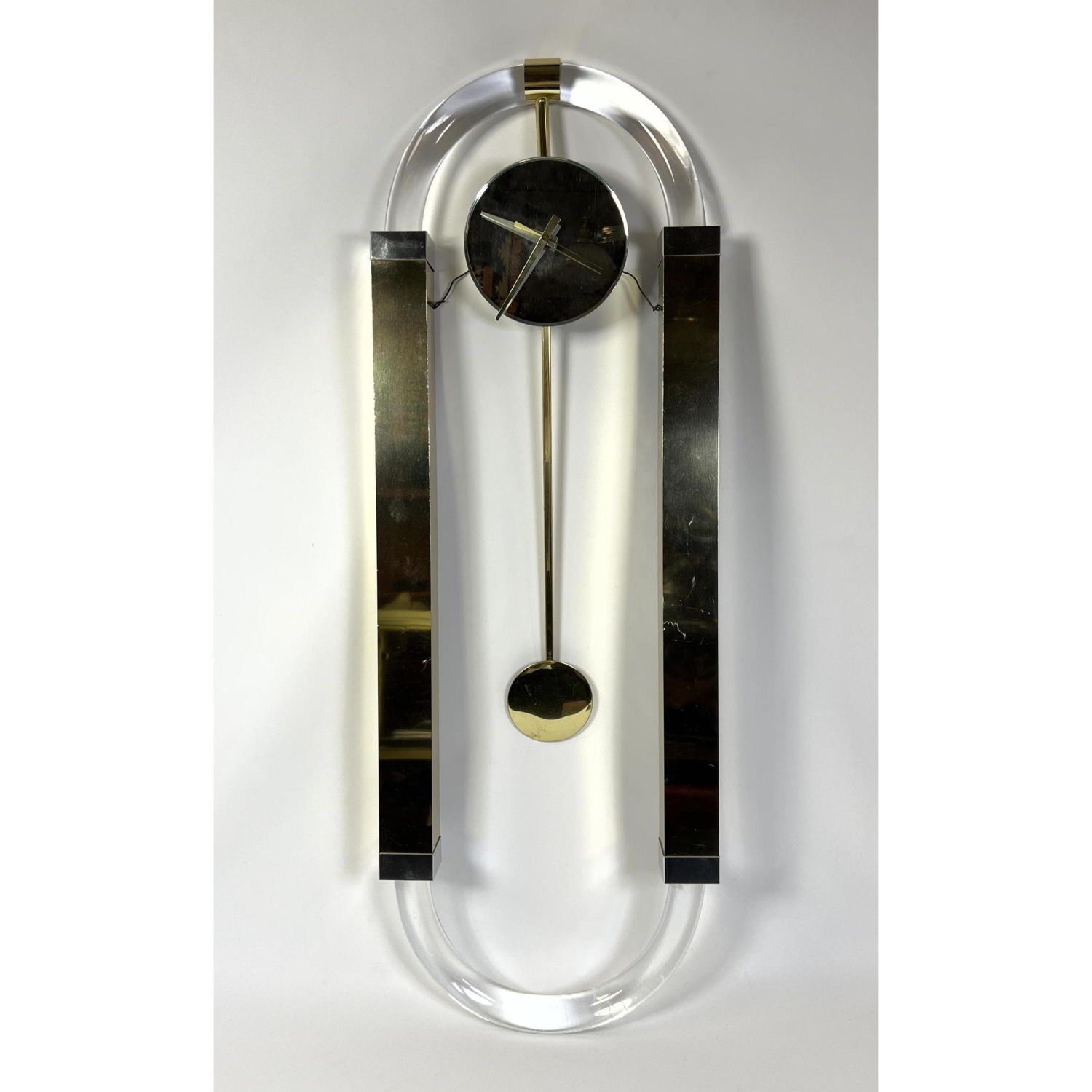 Appraisal: Lucite Brass Modernist Pendulum Wall Clock Mirrored Face Quartz Movement