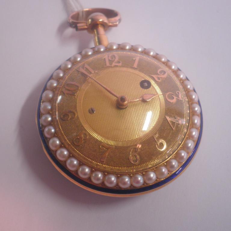 Appraisal: An enamelled and seed pearl decorated pocket watch yellow metal