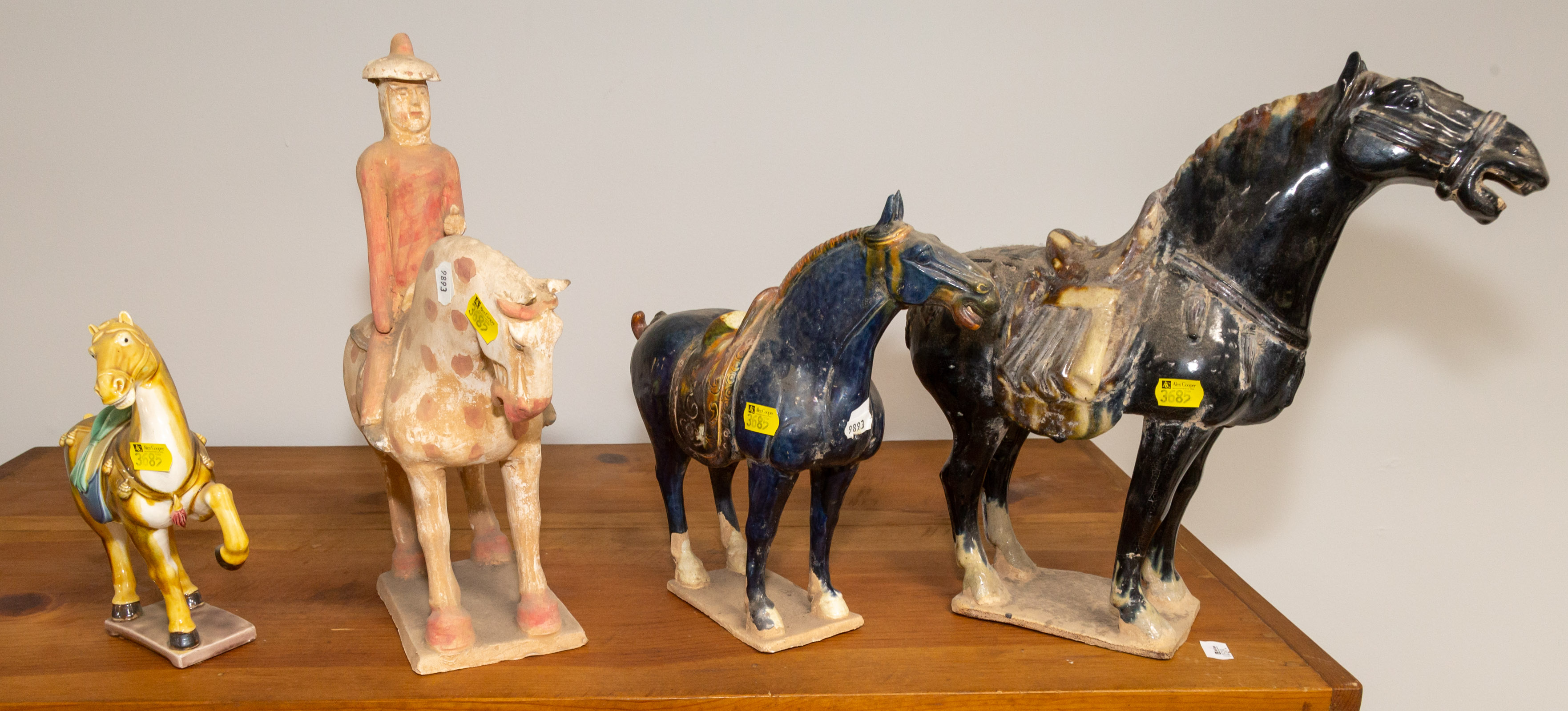 Appraisal: FOUR CHINESE ANTIQUE STYLE CERAMIC HORSES th century comprising two