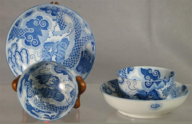 Appraisal: English soft paste handleless cups and saucers dragon seeking flaming