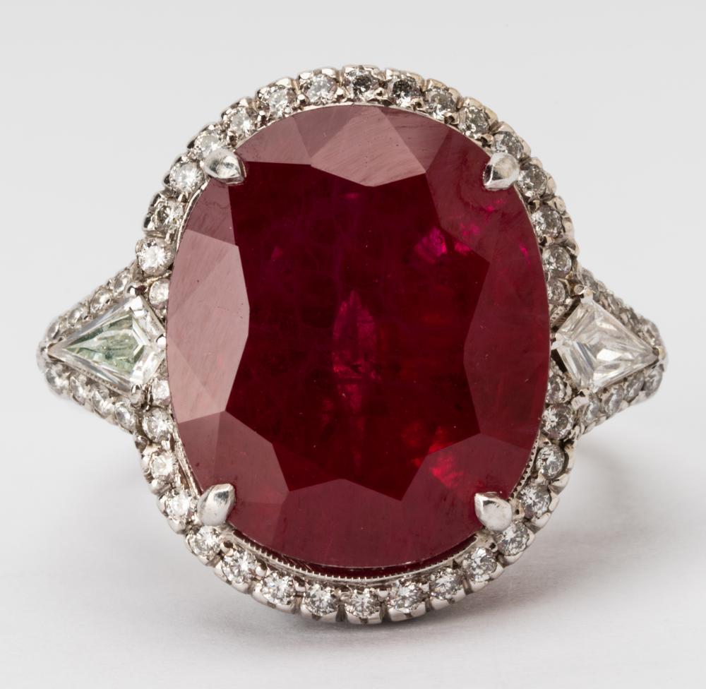 Appraisal: WHITE GOLD RUBY DIAMONDCenter set with oval mixed cut reconstructed