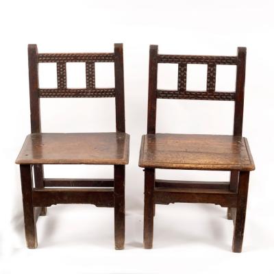 Appraisal: A pair of th Century Spanish walnut chairs with solid