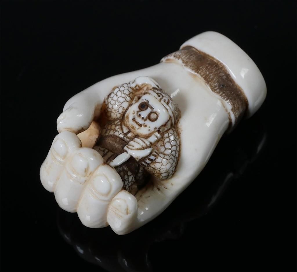 Appraisal: SIGNED JAPANESE IVORY HAND NETSUKE FIGURINESigned old Japanese netsuke Sculpture