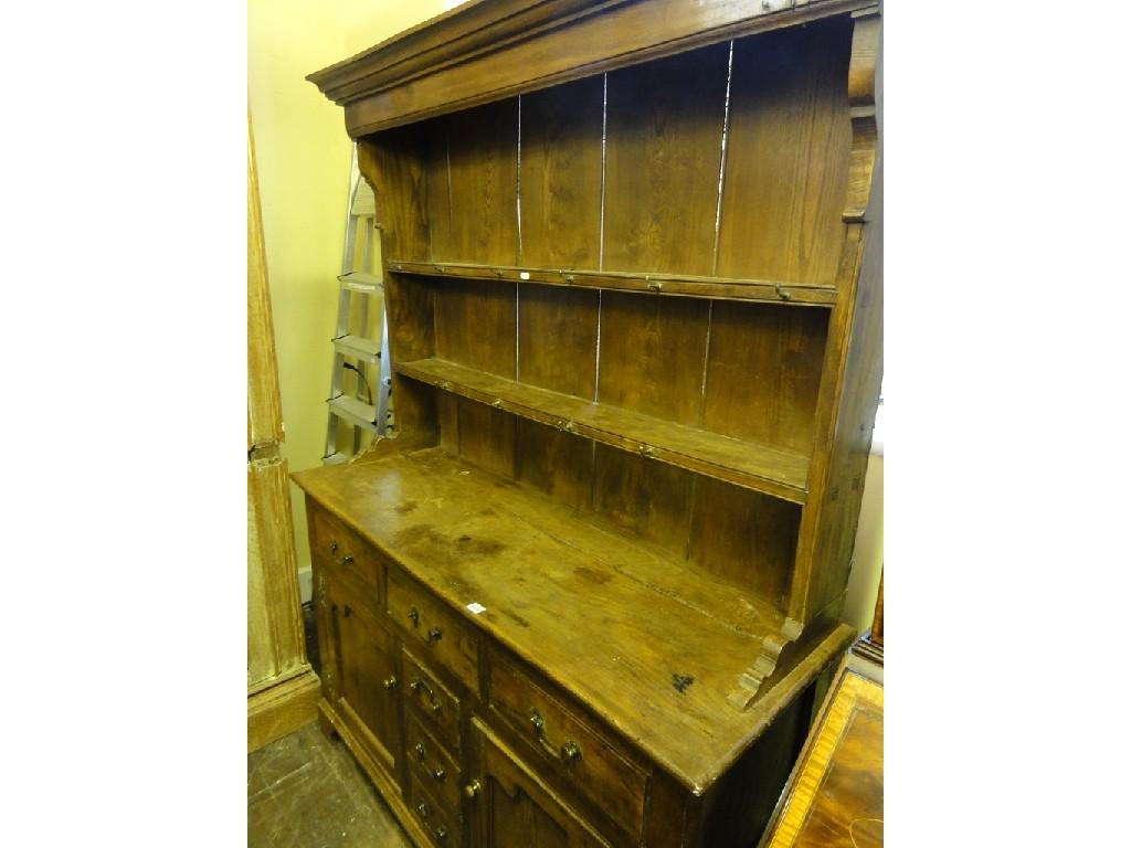 Appraisal: A elm dresser in the Georgian style the base fitted