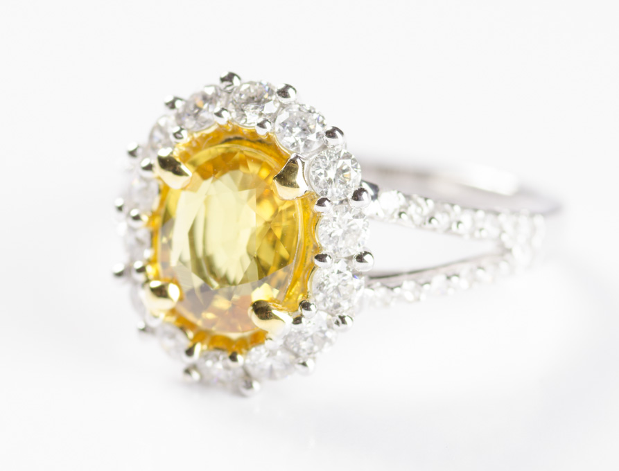 Appraisal: YELLOW SAPPHIRE AND FOURTEEN KARAT GOLD RING The white and