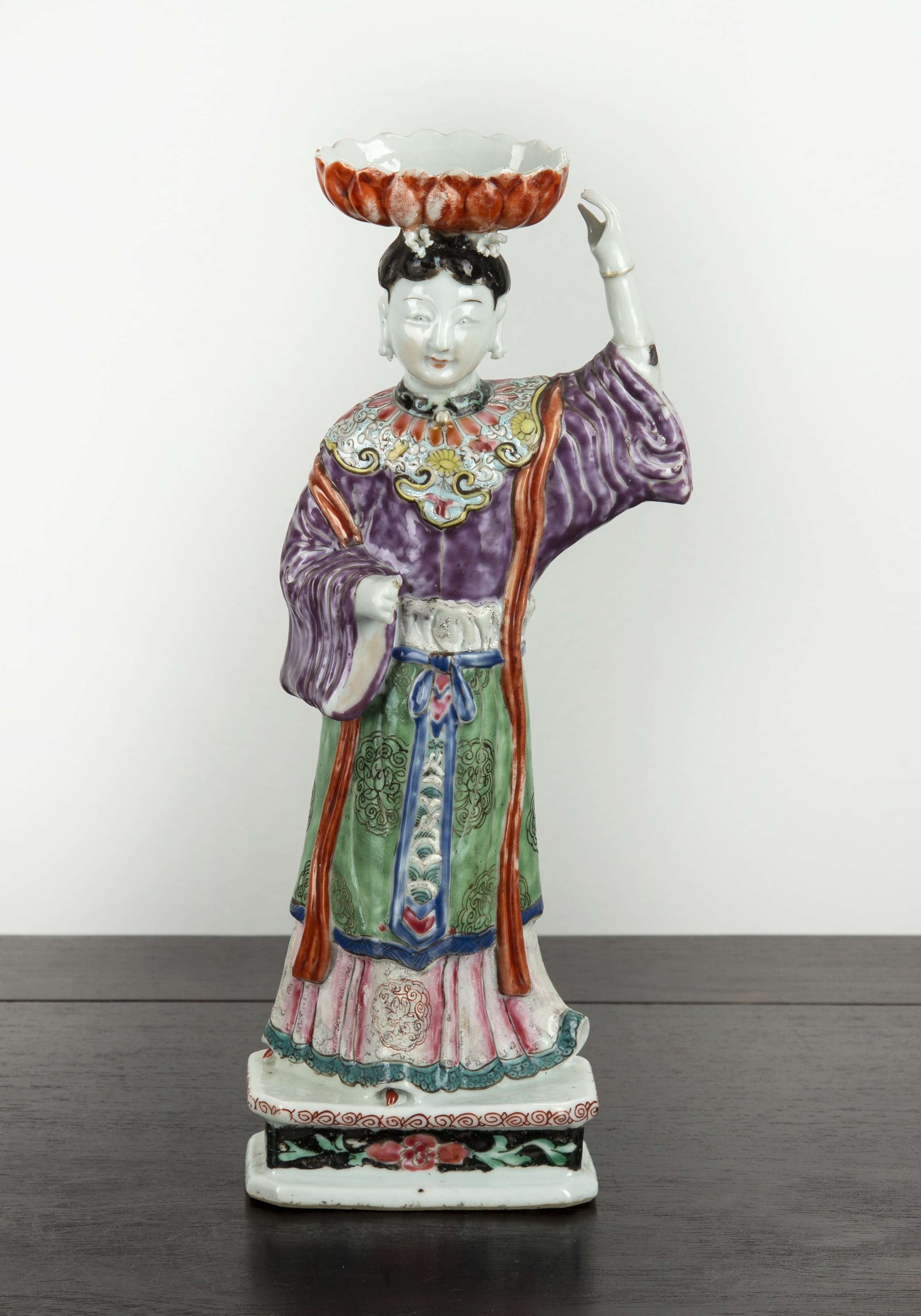 Appraisal: Famille rose candleholder in the form of a standing figureChinese