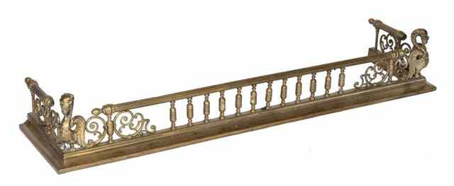 Appraisal: A TH CENTURY POLISHED BRASS FENDER of fluted rail form