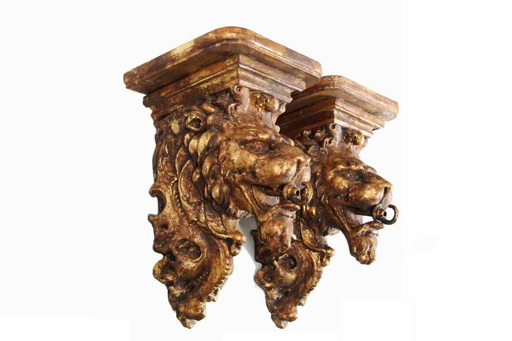 Appraisal: FIGURAL WALL SHELVES - Pair of cast resin lion head