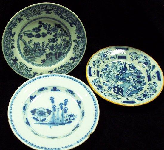 Appraisal: A late th Century Delft plate painted birds chrysanthemums and