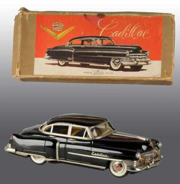 Appraisal: Tin Marusan Cadillac Car Friction Toy Description Circa Working Original