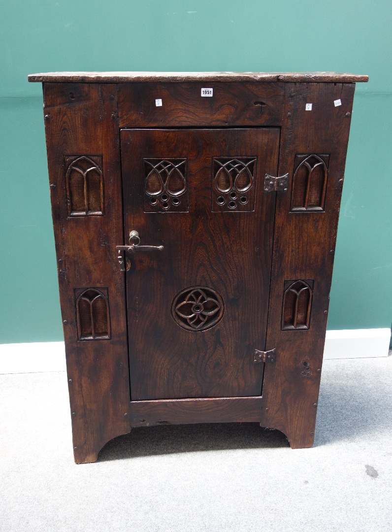 Appraisal: A th century style stained elm aumbry with single door