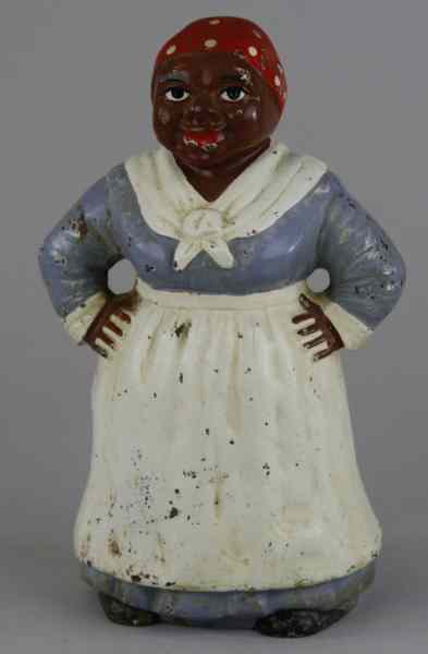 Appraisal: MAMMY DOORSTOP Hubley two piece three-dimensional casting fire casting details