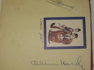 Appraisal: An autograph album containing a small illustration of Stan Laurel