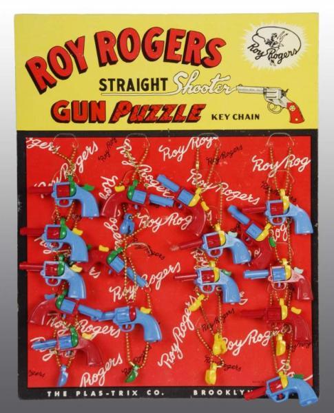 Appraisal: Roy Rogers Puzzle Key Chain Display Description Rare Condition Near