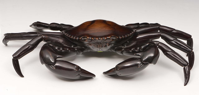 Appraisal: A Japanese dark wood okimono of a crabMeiji periodcarved and