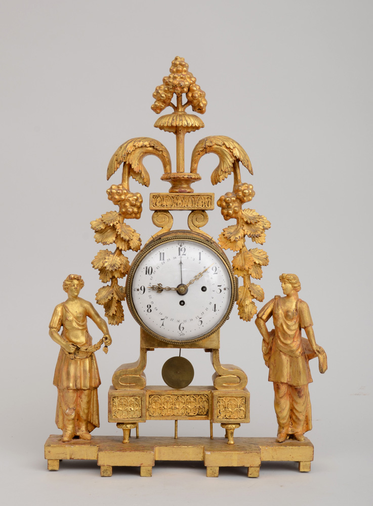 Appraisal: ITALIAN NEOCLASSICAL CARVED GILTWOOD CLOCK The white enamel dial in