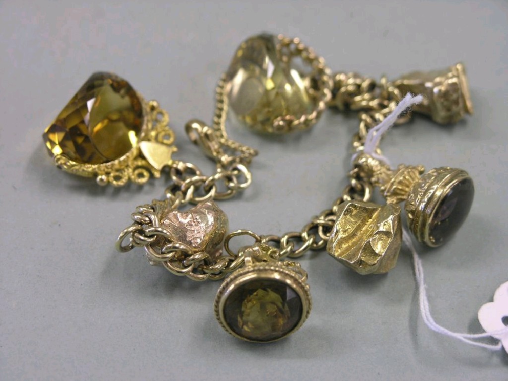 Appraisal: A ct gold charm bracelet charms consist of two mounted