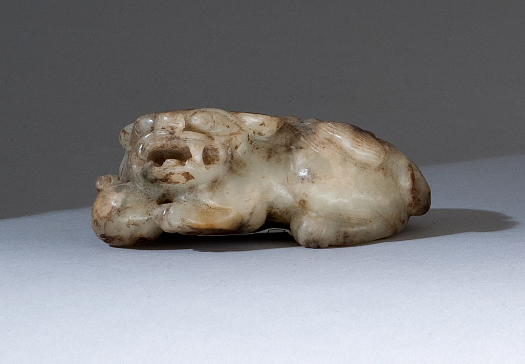 Appraisal: BROWN AND GRAY JADE CARVING th CenturyIn the form of