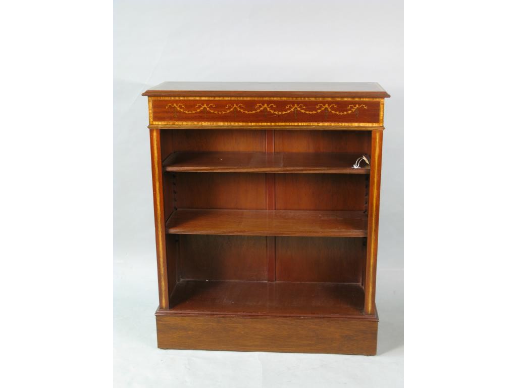 Appraisal: A reproduction inlaid mahogany open bookcase frieze inlaid with harebell