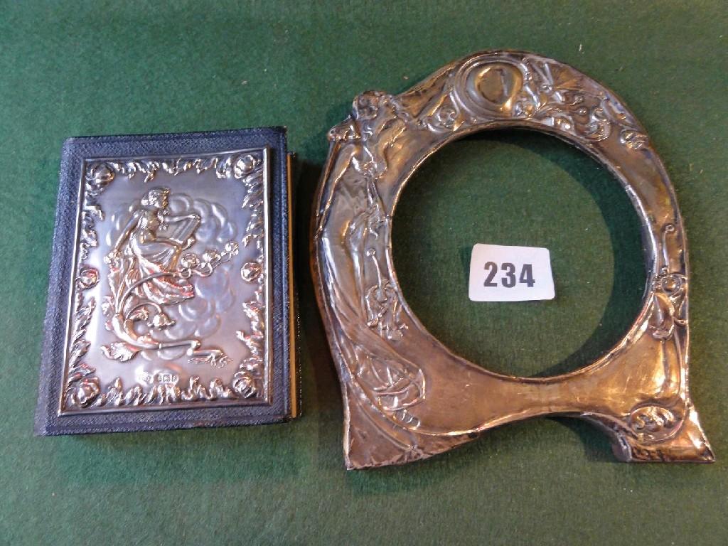 Appraisal: An Art Nouveau style silver photo frame with relief decoration