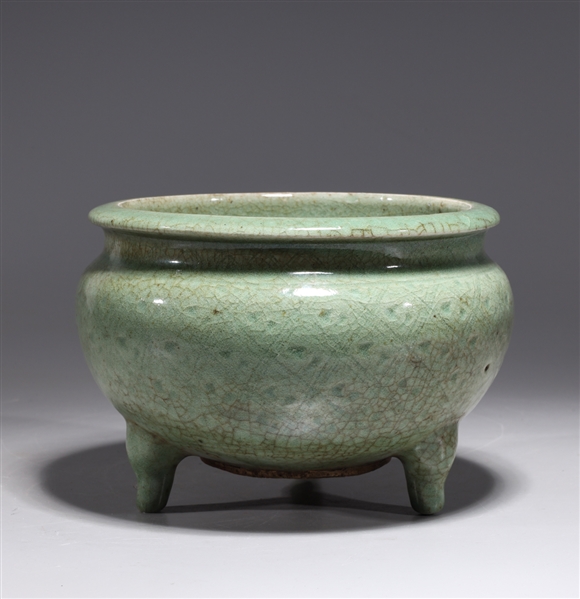 Appraisal: Chinese celadon glazed ceramic tripod censer with incised designs to