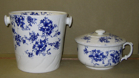 Appraisal: STAFFORDSHIRE POTTERY TWO-PIECE CHAMBER SET Blue flowers on white ground