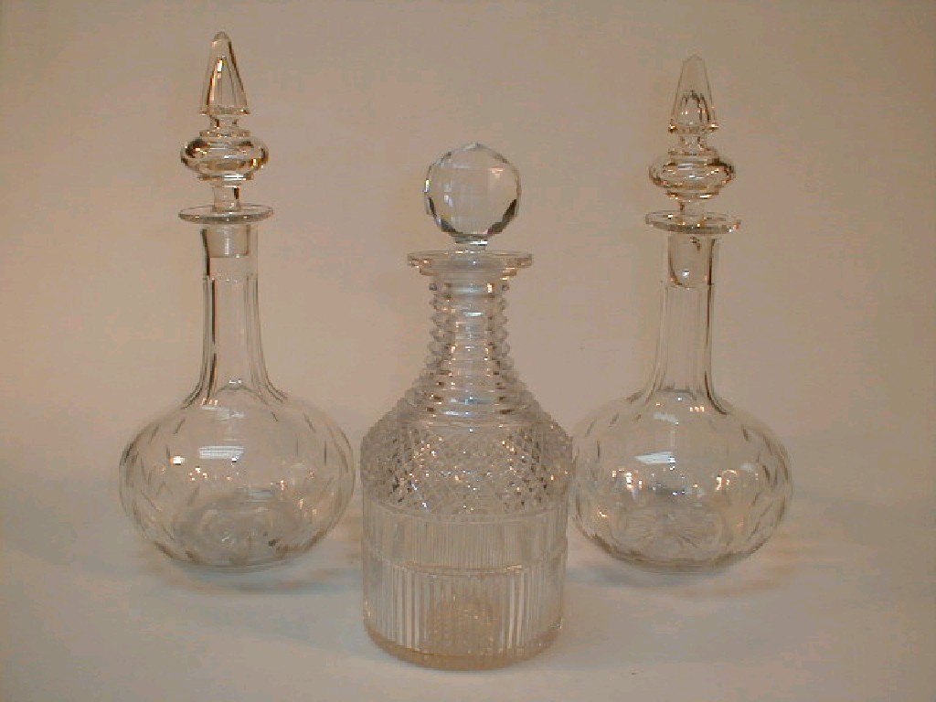 Appraisal: A pair of thC slice cut decanters with associated blown