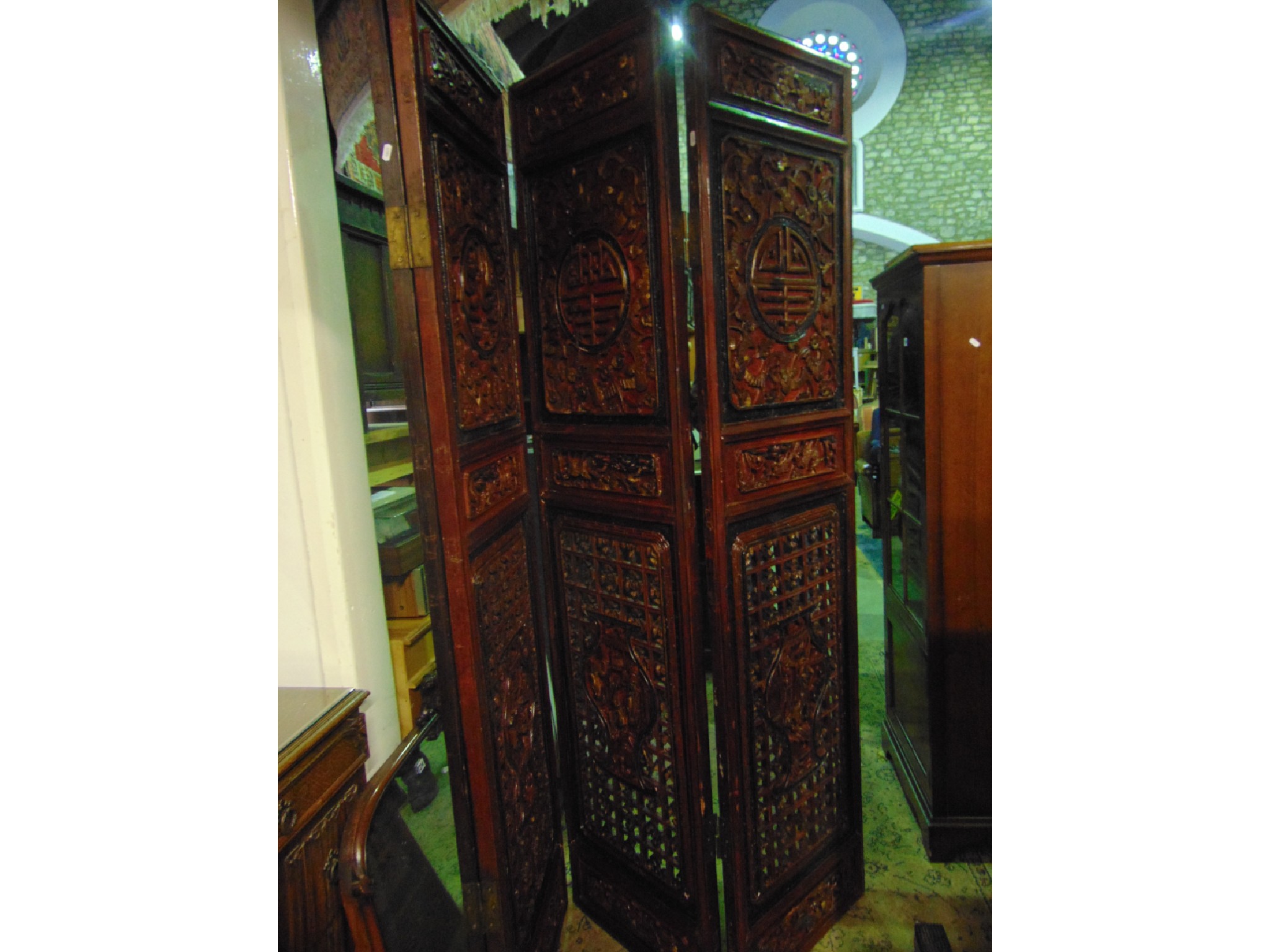 Appraisal: A substantial Chinese cut timber folding screen room divider with