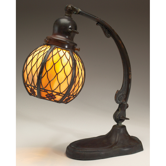 Appraisal: Handel bridge lamp adjustable base supports an overlaid shade base