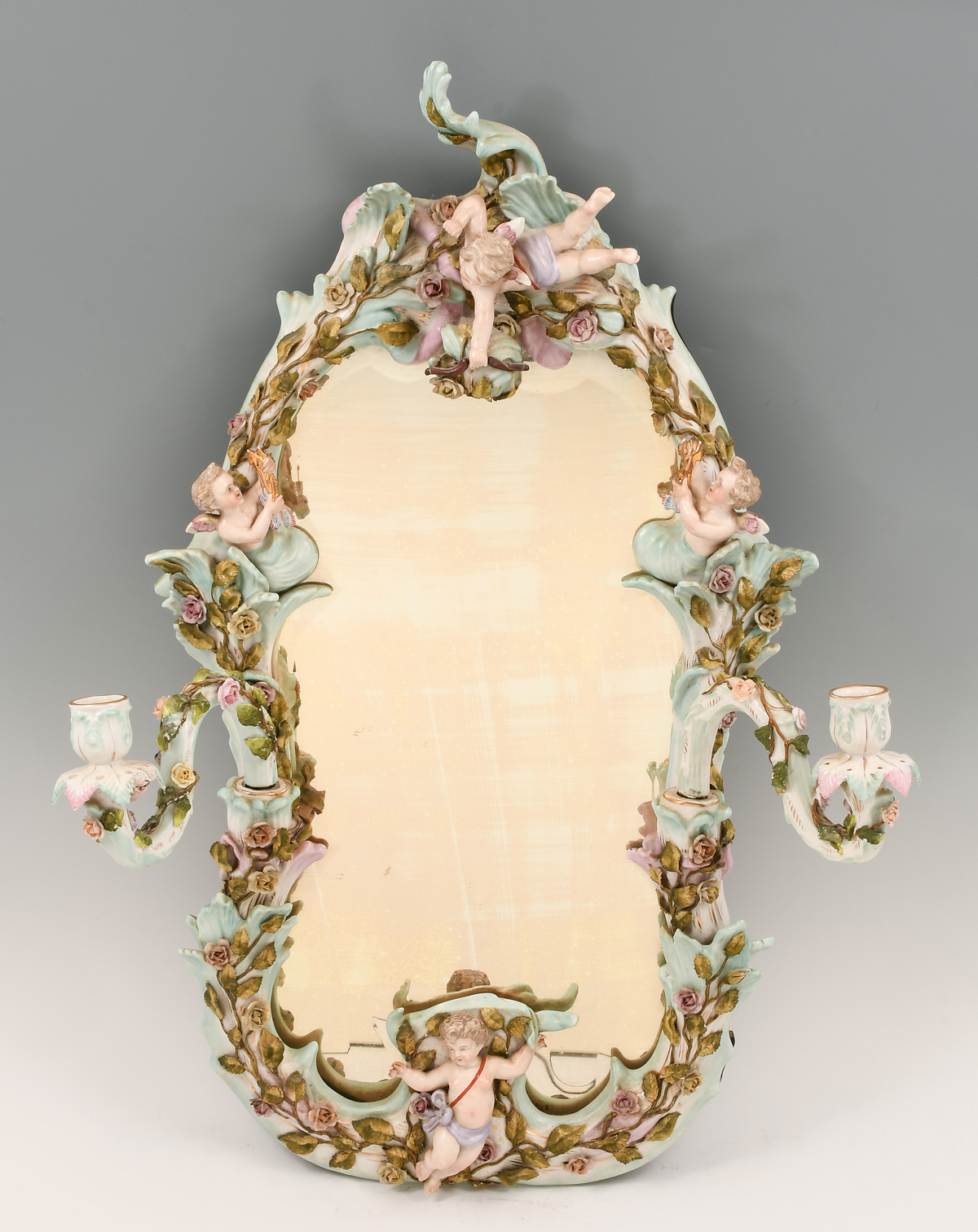 Appraisal: MEISSEN STYLE PORCELAIN CHERUB MIRROR Sectional porcelain frame having attached