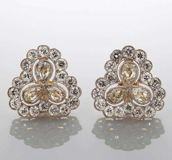 Appraisal: A pair of diamond earrings each centering three pear-shaped diamonds