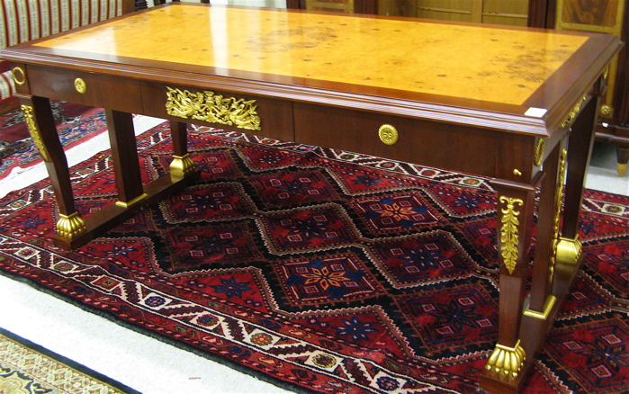 Appraisal: EMPIRE STYLE PARCEL-GILT MAHOGANY BUREAU PLAT having a rectangular burl