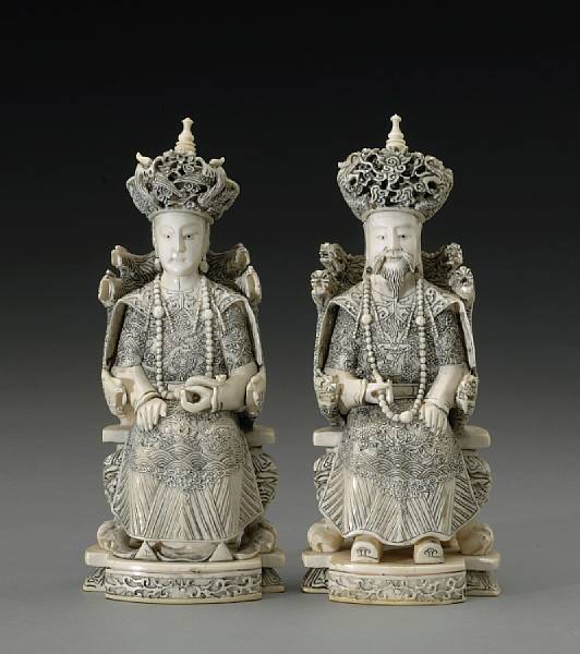 Appraisal: A pair of pieced and tinted ivory emperor and empress