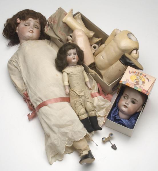 Appraisal: DOLLS AND PARTS Three German bisque-head dolls including Armand Marseilles